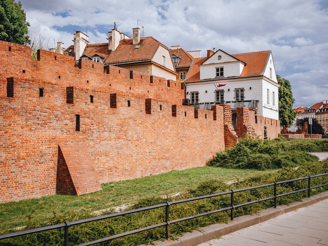 a large brick wall with several windows on top of it
